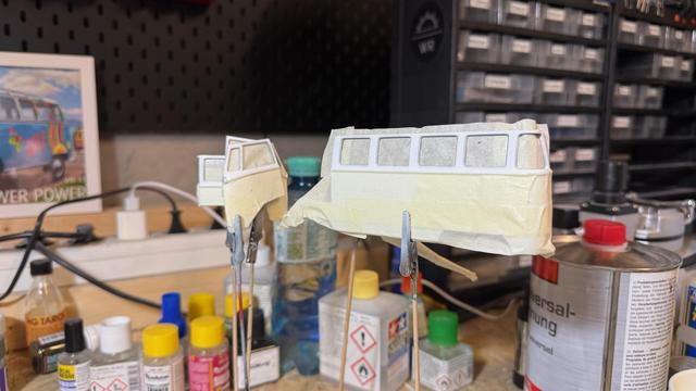 Painted parts of a VW T1 Samba Bus by Revell in 1:24.