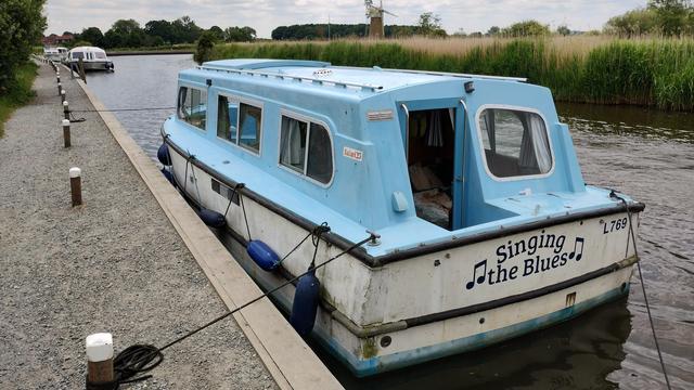 Singing the Blues, our boat, on the Broads Authority moorings at How Hill.