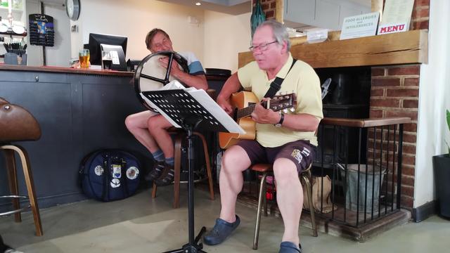 Peter (guitar) and Ian (bodhran) entertaining at The Dog, near Ludham Bridge.