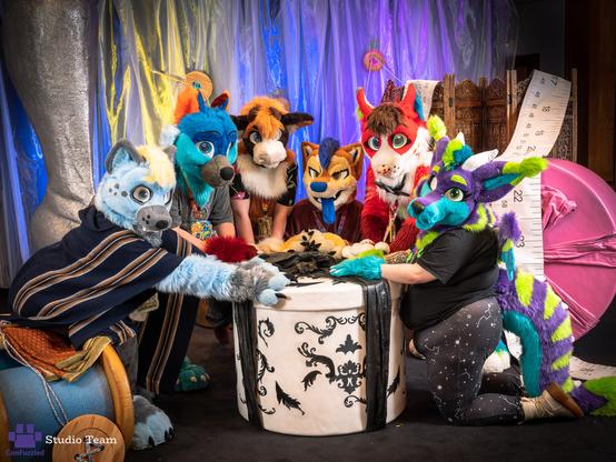 Bunch of fursuiters being micro in a fashion landscape of giant props