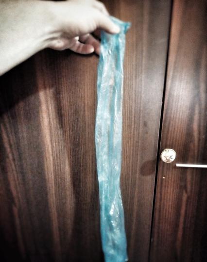 cellphone photo of a gigantic condom