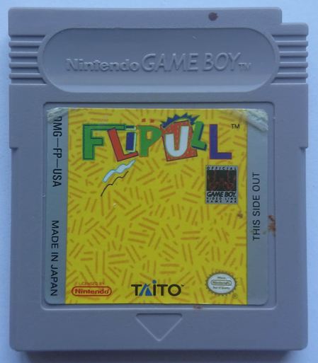 a game boy cartridge ("DMG-FP-USA") with a label reading "FLiPULL." the lettering is garish in color, green/orange/blue, and includes a mix of roughly drawn geometrical shapes with disparate outlines and shadows, all over a loosely crosshatched background (orange over yellow). logos: TAITO, Game Pak, "Licensed by Nintendo," and "Nintendo seal of quality"