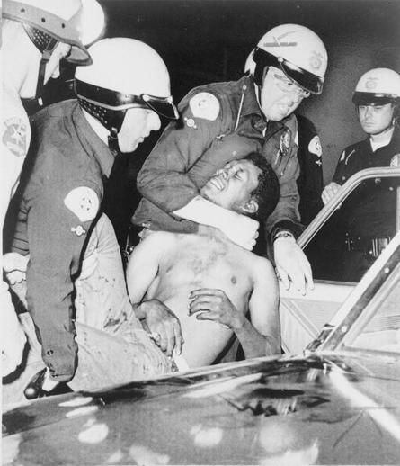 Police arrest a man during the Watts Riots. Image marked as August 12.
Date 	12 August 1965
Source 	LOC
Author 	New York World-Telegram (public domain)