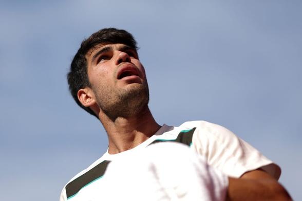 Carlos Alcaraz looks on during his win over Arthur Rinderknech at Queen's