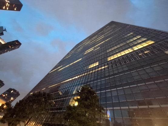 A late night view looking up at the UN Secretariat building in New York from its staff exit.