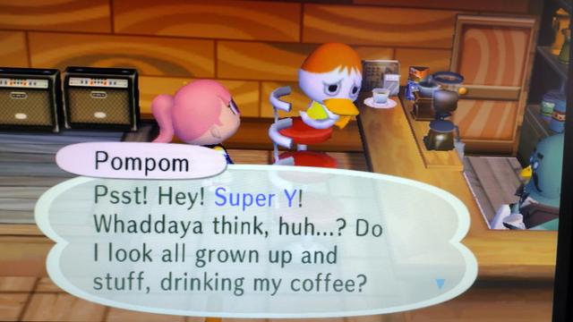 City Folk. Pompom the duck sits at the coffee shop. She looks sheepish. She is saying "Psst! Hey! Super Y! Whaddya think, huh...? Do I look all grown up and stuff, drinking my coffee?"