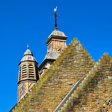 The roof features of a late Victorian civic building.