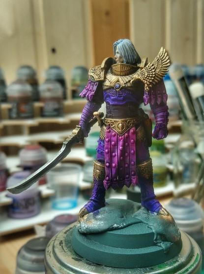 Work in progress of a miniature of 30k Fulgrim. The metal parts and face are done, the rest is base colours blocked in.