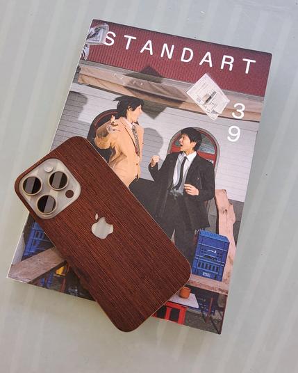 Standart Magazine issue 39 with iPhone 15 Pro that has a wood skin.