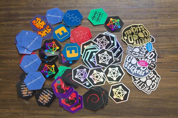 a pile of hexagonal stickers spread out on a table