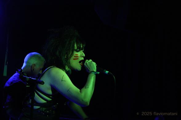 Singer of a post-punk band, performing on stage