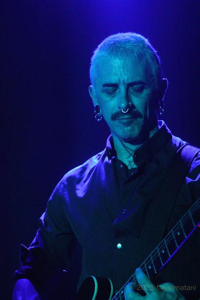 Guitarist of a post-punk band, performing on stage