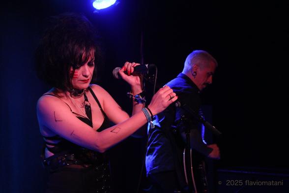 Singer of a post-punk band, performing on stage
