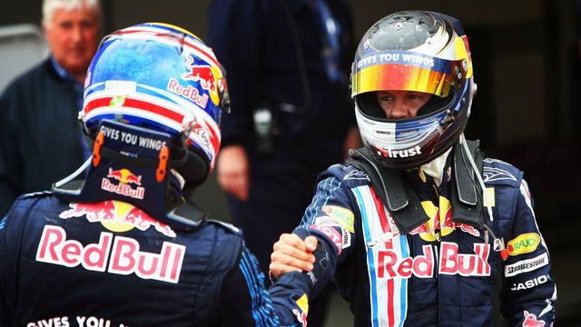 Sebastian and Mark Webber shake hands in parc ferme.