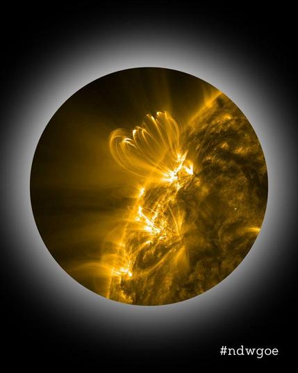 The Sun in extreme ultraviolet light: A section of the solar disk, displayed in the distinct Night of Science design.