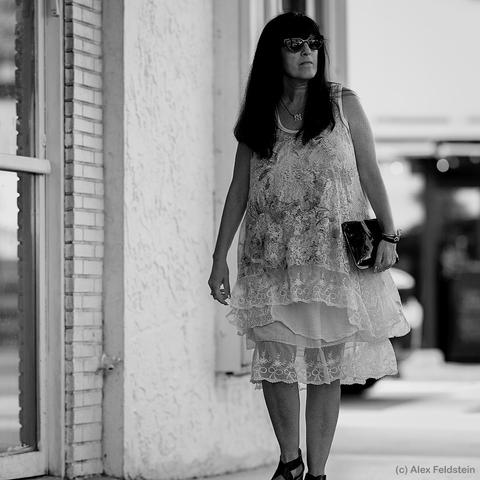 Woman walking past the camera (B&W)