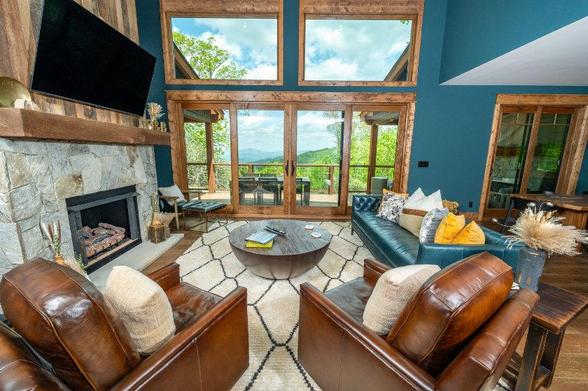 Lounge with big doors and windows and blue walls.