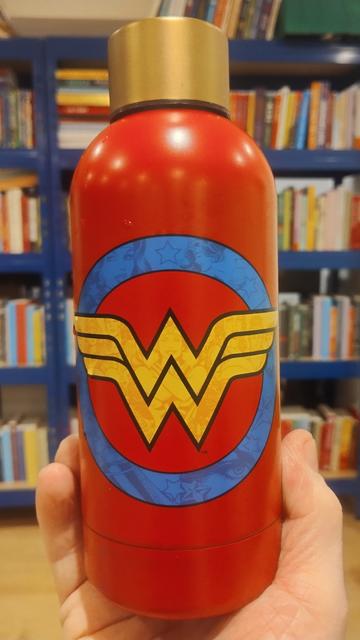 Red, metal water bottle with gold top and interlocking winged "W"s for Wonder Woman symbol