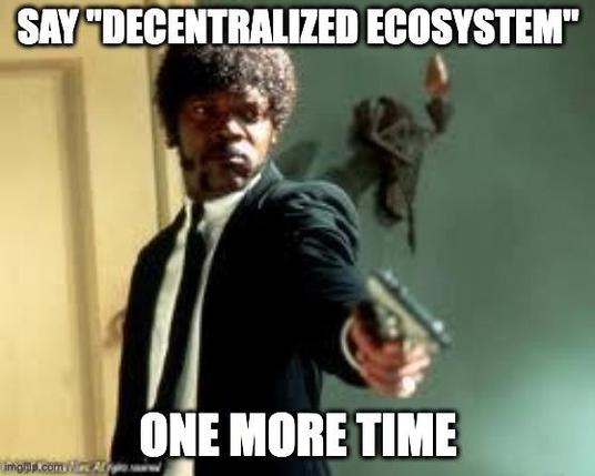 Meme picture from the movie Pulp Fiction: Jules holding a gun next to the words "say 'decentralized ecosystem' one more time".
