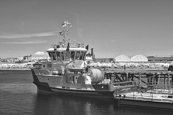 Oil spill ship tied up at dock.