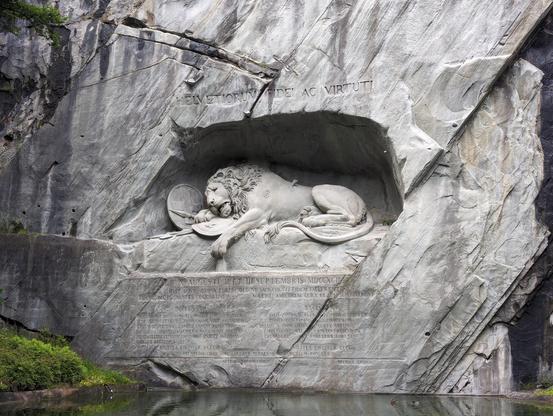 Löwendenkmal in the English Garden in Lucerne. A sculpture of a wounded lion, about three times the real life size, carved in a cliff, over a serene water pool. It gives a sense of immense mourning and is absolutely massive.

It is also a rather controversial monument, and has been, since it's creation a good 30 years after the French revolution, and was driven by Swiss conservatives and funded by European royal families. It commemorates the Swiss guard regiment who got killed covering the retreat of the French royal family. As Swiss public was generally in favour of of the French revolutionary movement, this was an attempt to sway its opinions.