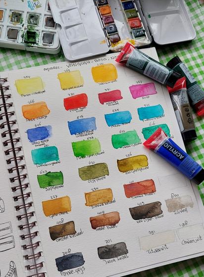 All kind of colours in squares with the name of the colour and two brushes.