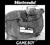 Ich, der vorfreudige ft1, wurde von der GameBoyCamera fotografiert wie ich in der Umhängetasche von meinem Menschy mich auf das Treffen mit den anderen Plushies freue :D.
