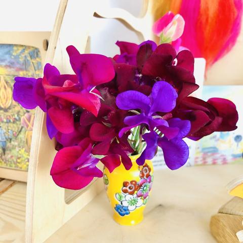 Closeup of the vase with sweet pea flowers