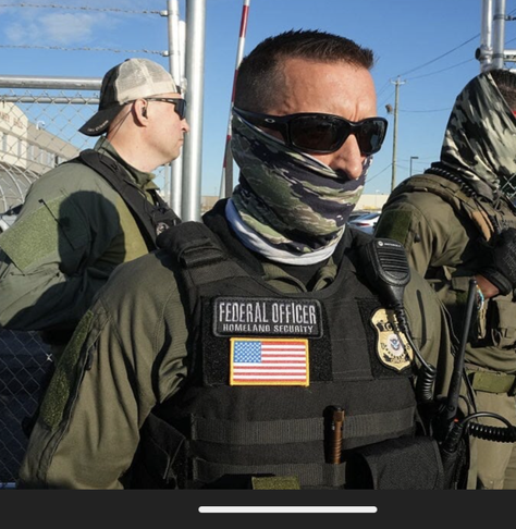 NOT A MASK:
Photo of a militia member in uniform, with bullet-proof vest bearing Homelabd Security insignia and badge. They have a camo neck gaiter pulled up to cover their mouth and ears, but not their nose.

This is not a mask, but an identity obfuscation tactic - the government knows that ears can be used like fingerprints to identify individuals.

Photo source: https://statuskuo.substack.com/p/supercharging-ice