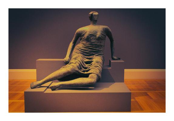 This sculpture depicts a robust, abstract female figure seated, her form heavily cloaked in drapery. Cast in dark bronze, the surface has a rich, textured patina, emphasizing the folds and curves of the fabric that envelop her. Her head is small and somewhat featureless, almost absorbed by the voluminous drapery, and her limbs are implied beneath the heavy material rather than explicitly defined. The figure exudes a sense of monumental stillness and weight, with the deep crevices of the drapery creating strong shadows that enhance its three-dimensional presence. She sits on a simple, integrated base, suggesting permanence and earthiness.