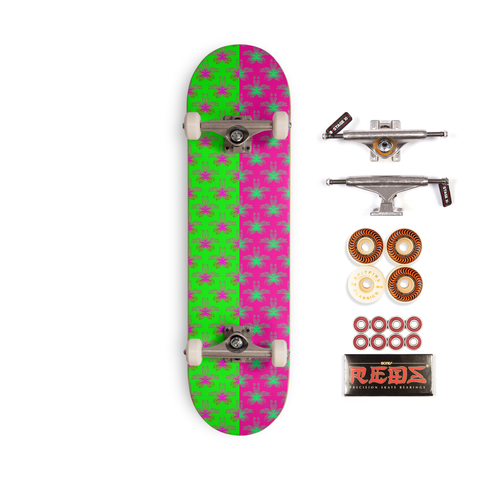 A skateboard with weird weed leaf art. The left half of the design has a neon green background with hot pink pot leaves in a repeating pattern. The right half of the design has a hot pink background with mint green cannabis leaves in a repeating pattern.