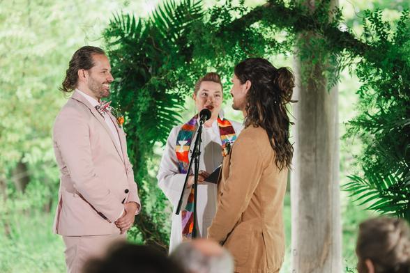 Two beautiful grooms getting married in Milwaukee on their wedding day at Schlitz Audubon Nature Center