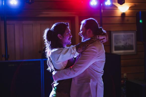 Two beautiful grooms dancing on their wedding day at Schlitz Audubon Nature Center
