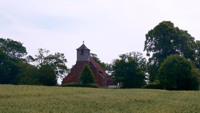 Once generations of agricultural workers toiled in these fields. Their earthly remains now lie in peace around the C12 church, their jobs replaced by mechanization. Now the village has mostly disappeared, the parish boundaries changed, but its much loved church remains.  St Mary's church at Buttsbury, Essex, England. June 2025