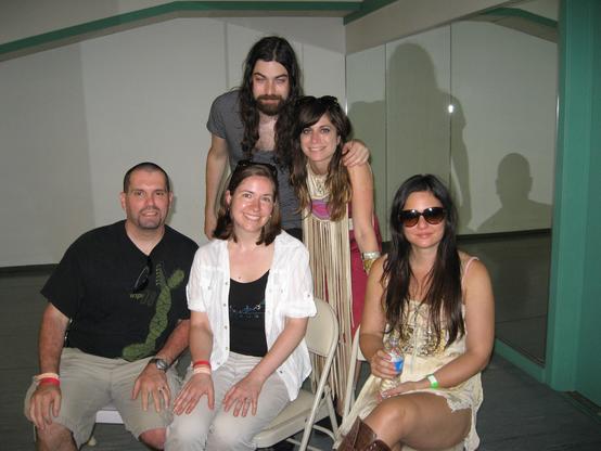Photo of me and my wife (sitting, left and center) meeting Nicole Atkins (standing at right) and her band in 2011.