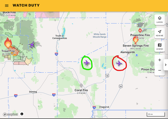Water tanker aircraft, fighting forest fires in southern New Mexico...have clearance to cross White Sands Missile Range.

The aircraft icon circled in red has just existed the restricted area of the range, and the icon circled in green is just entering the restricted area.