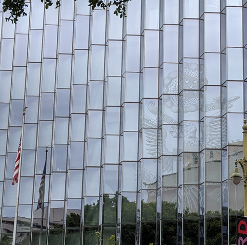 The US seal on a mirrored building