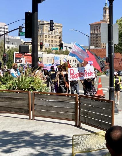 People's Pride banner at head of march.
