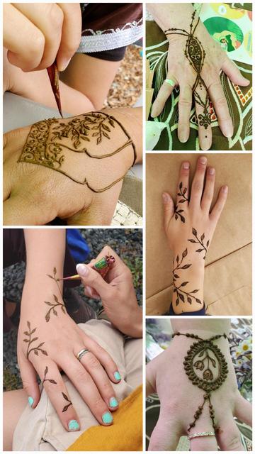 Top Left: A close-up of a hand being decorated with henna. The hand is adorned with detailed foliage design. A henna cone is visible, being pointed at the wrist.

Top Right: A hand with henna design covering its back. The art stretches down the middle finger and looks like a teardrop. There is a patterned table or cloth in the background.

Middle Right: Medium shot of a hand with a long leaf-vine pattern. The background is a solid brown with a slight gradient.

Bottom Left: A close-up of a hand being decorated with henna and a leaf-vine pattern. A henna cone is visible near wrist.

Bottom Right: A close-up of a hand with a round henna pattern across the back. It has a foliage design inside and also a beaded-string reaching down towards the middle finger with a diamond ring clearly seen.