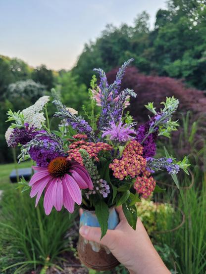 A fresh bouquet of yarrow, mint, monarda, butterfly bush, cone flower, lavendar, American germander, lemon Verbena, and oregano.