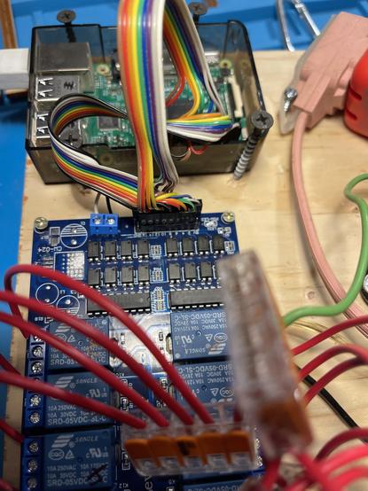 A raspberry pi board connected to a board with 16 AC relays to form a DIY sprinkler controller for the old 1960’s sprinklers that defy puny 850mA max modern controllers.