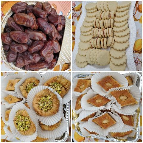 A four-panel composite image. Upper-left: High-angle close-up of dark brown dates in an ornate silver and gold bowl, filling the frame. Upper-right: Medium shot of rows of light-colored scalloped sandwich cookies arranged on a white tray. Lower-left: Close-up angle of flaky baklava pastries in white paper cups and topped with chopped pistachios inside of a decorative silver tray. Lower-right: Angled close-up of diamond-shaped pastries, light brown with a bumpy texture, each topped with a single blanched almond, in a decorative silver tray.