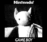 Ich, der reiseerfahrene ft1, sitze in einer Cappy auf einem Klapptisch in einem Zug und warte auf die Abfahrt (Nahaufnahme mit GameBoy-Camera).