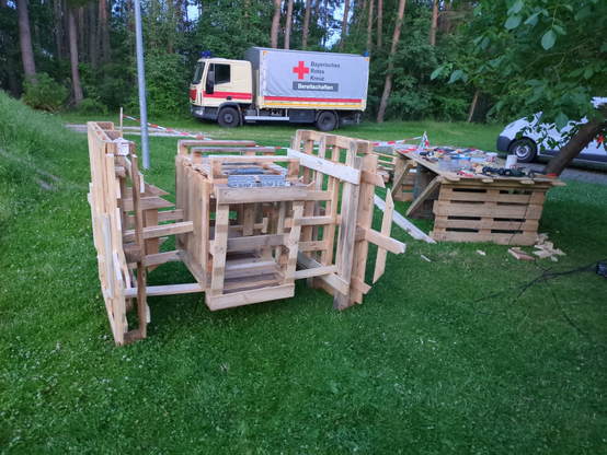 tie fighter from start wars made out of wood, mostly wodden pallets