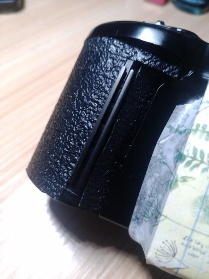 first pass of grip tape over the camera