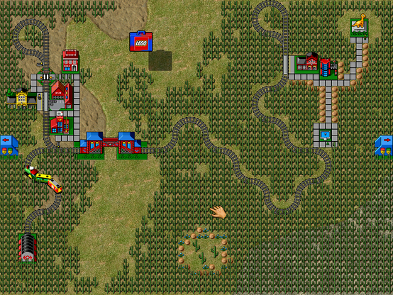 LEGO LOCO screenshot showing a forest with a train track going through it. On the left bottom there's a train depot, which leads to (upwards in the map) a post office and station and some other buildings. From here the track crosses a bridge and goes rightwards in curves through the forest until it reaches another station on the right side of the map. There there's another building, a fountain and dinosaur statue.
There's a blue tunnel on the left and right sides of the map, but they are not connected to tracks.