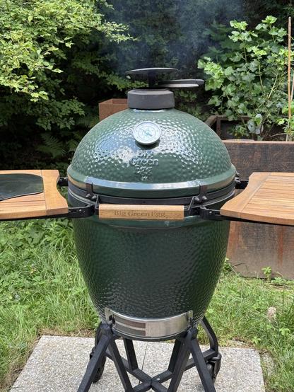 Our Big Green Egg warming up. We put the rain protector on top of it because there was a chance of short, but heavy rain. Fortunately, it did not rain.