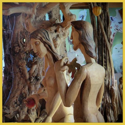 Adam and Eve, apple and fig leave in their hands, carved in wood. Taken (2021) at a the exhibition 'biblestories' in the ark of Noah, build by a Dutch entrepreneur.