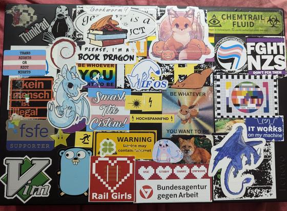 Lots of stickers on a laptop