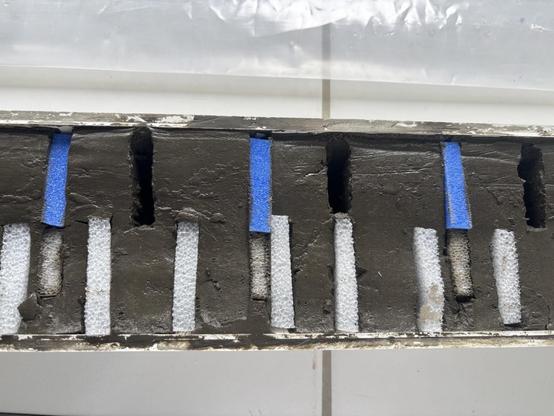 One of the marine sediment cores—sorry, no spoiler for you today!—sampled at the EPOC (Environnements et Paléoenvironnements Océaniques et Continentaux UMR 5805) core repository—the holes show the positions of the newly picked sediment samples before plugging. Photo taken by Nina Davtian (it’s me!).